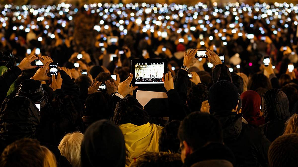 AI illustration of visitors photographing Pope Francis as he speaks from the central balcony of St. Peter's Basilica at the Vatican on March 13, 2013