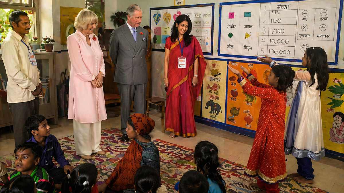 AI illustration of King Charles III and Queen Camilla visiting a school in India
